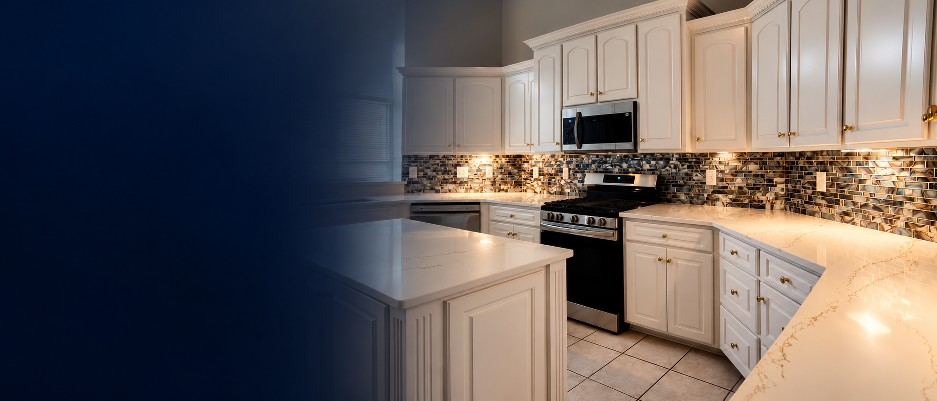 Finished kitchen with custom backsplash, white cabinetry, and marble-look countertops by Regal Backsplash Plus